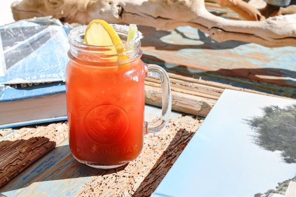 Michelada Cocktail with Olive Bloody Mary Mix, Mexican Lager, Hot Sauce, and fresh lime