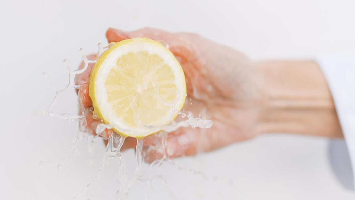 Fresh lemon juice squeezed by hand